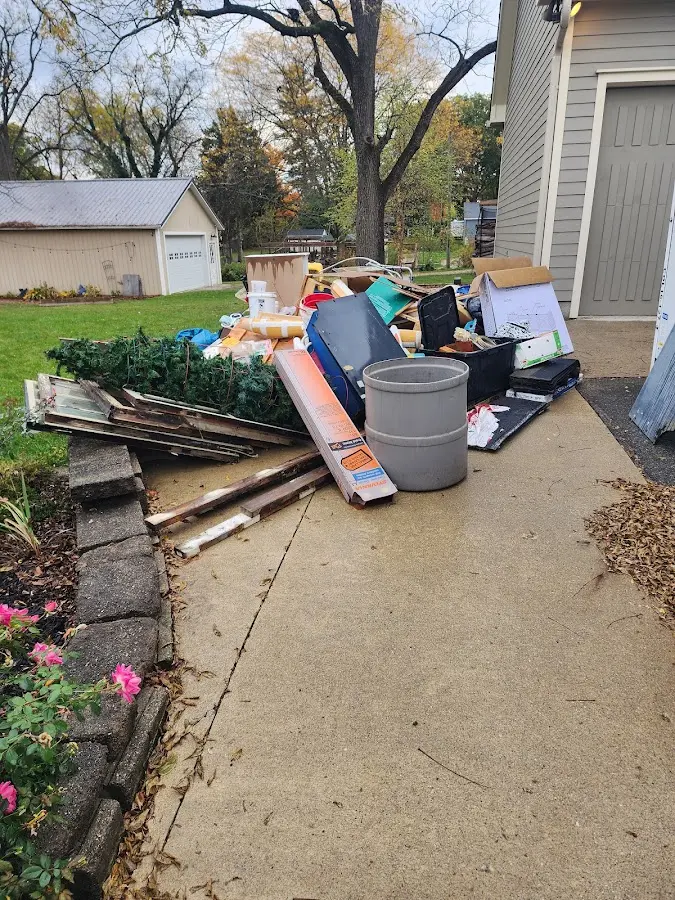 Dumpster being loaded with debris for 3 Yard Dumpster Rental in Lincoln